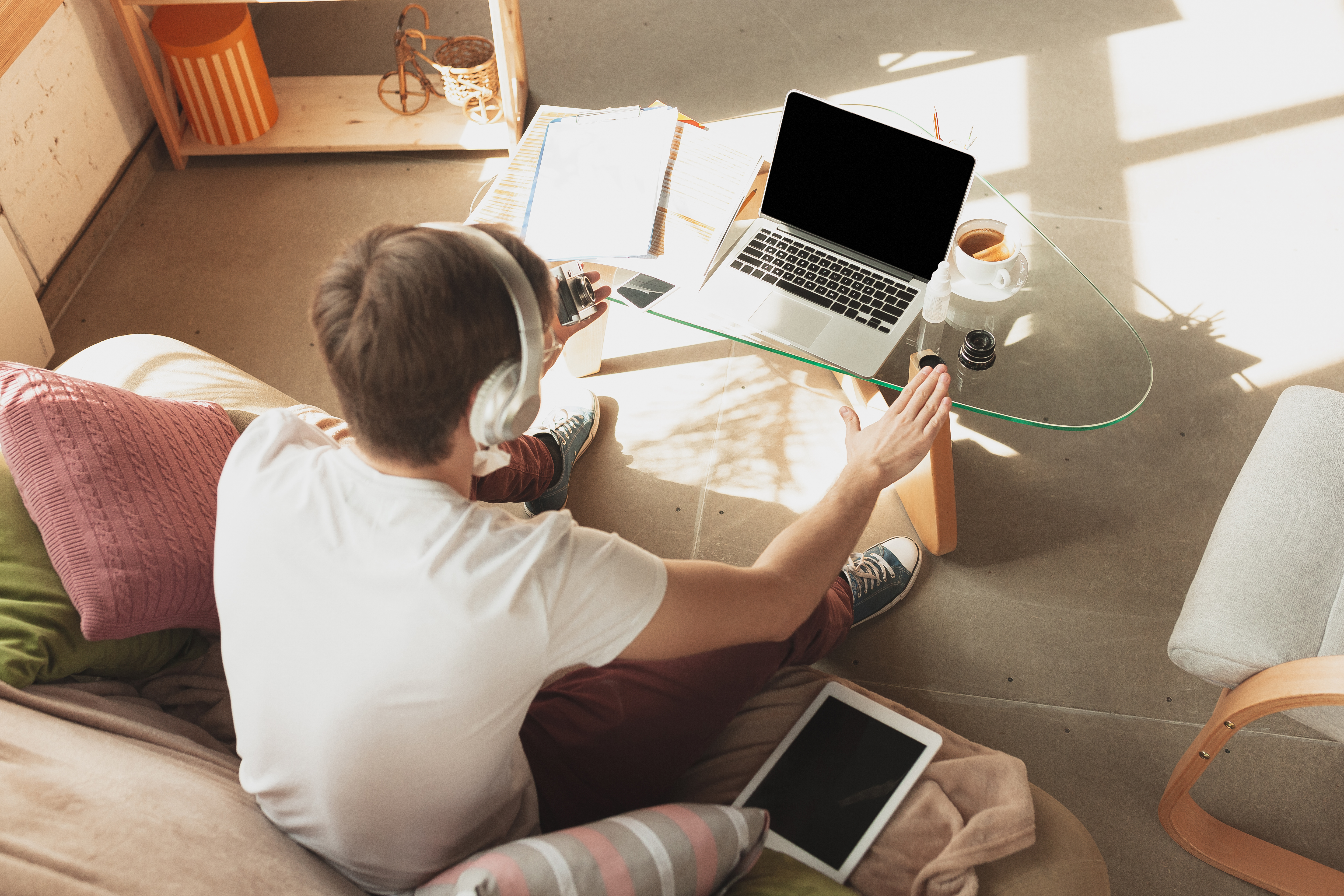 Young man studying at home during online courses for financist, economist, managers